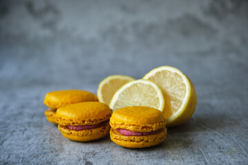 yellow lemon macaroni cookies on a gray background