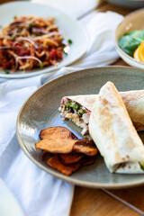 Chicken tortilla with batat on a plate in restaurant