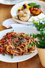 Healty fresh green food pasta on the wooden table 