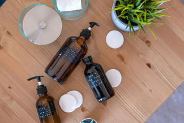 Apothecary Bottles on Wood Table with Cotton Swabs