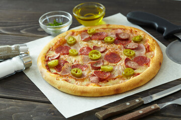 tasty pizza on the wooden background