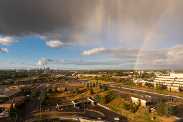 Rainbow and storm over city skyline