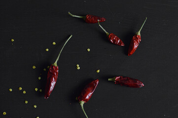 Red chili pepper whit seed on black background
