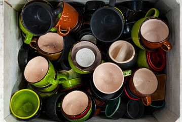 Many colorful ceramic or pottery cups, top view