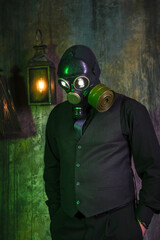 cosplay of a guy in a gas mask on a green background with glowing eyes