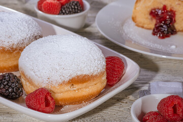 Berliner jelly filled doughnut with raspberry and blackberry.