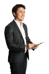 Attractive asian businessman in a dark grey suit holding a clipboard looking away from camera...
