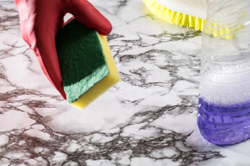 person cleaning objects and table