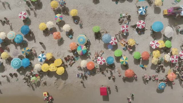 a drone flying over umbrellas