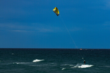 Kite surfing on a windy day offshore in Juno Beach Florida.