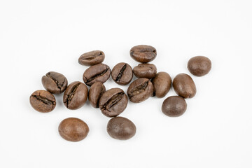 macro shot of roasted coffee beans on a white background