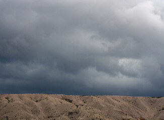 Fototapeta na wymiar Dark clouds over the mountains.