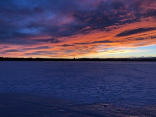 Beautiful sunset over the frozen lake