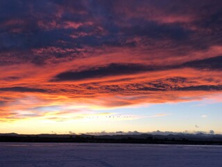 Beautiful sunset over the frozen lake
