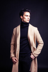 Obraz premium handsome asian fashion looking man posing in studio on black background, lifestyle modern people concept