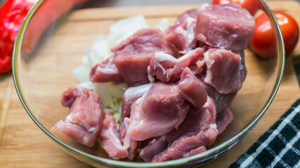 Top view of raw Pork tenderloin on glass bowl, Fresh raw meat prepared for cooking
