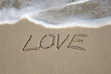 inscription on the beach, Beach sand messages : Love written in the sand on beach with wave. Concepts photography. Selective focus 