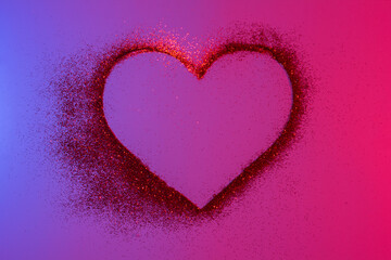 Happy Valentine's Day. Heart of red bright sparkles and glitter in pink-blue neon lights.Artistic design colorful and shiny bright background