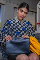 Young girl in vintage clothes at old train station