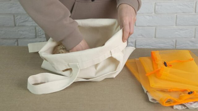 Eco shopping bags concept. Woman use eco mesh.