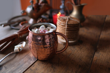 cup of hot cocoa with marshmallows, candles, gifts, sweets, concept of merry christmas, cozy winter mood, holiday