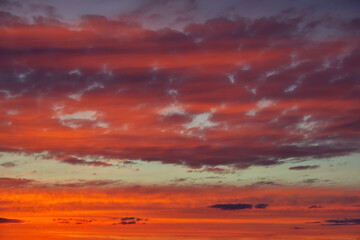 Sky sunset in the evening with colorful orange sunlight. Beautiful majestic nature background