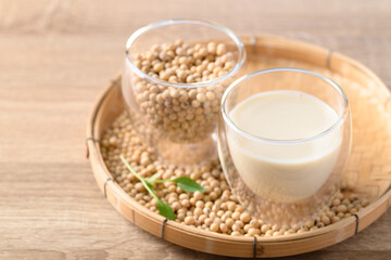 Soy milk and soy beans in a glass on bamboo tray, Healthy drink