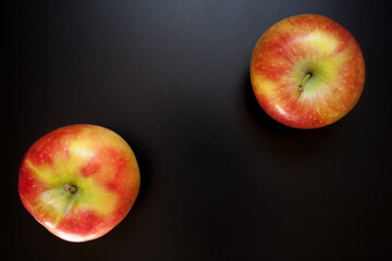 Apples on black table, food background