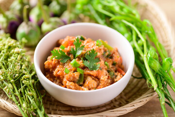 Northern Thai food (Nam Prik Ong), Spicy chili minced pork with tomatoes, Thai chili paste eating with vegetables