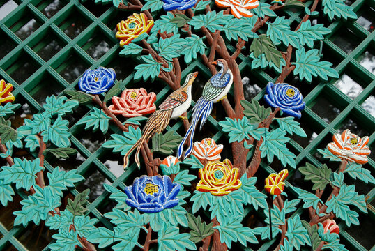 In Seoul, South Korea, painted birds, flowers, and leaves decorate a window lattice at Jogyesa temple, headquarters of Korean Buddhism's Jogye Order.