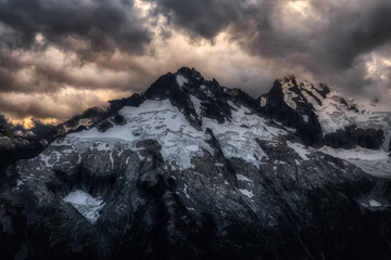 Obraz premium Aerial view of Canadian Mountain Landscape, Tantalus Range. Taken near Squamish, North of Vancouver, British Columbia, Canada. Dramatic Sunset Art Render