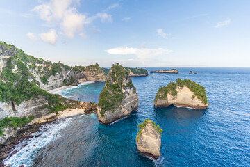 The spectacular coastline of Nusa Penida with soaring cliffs and impressive rock formations. Bali, Indonesia.