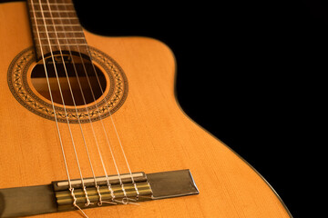 Obraz premium Spanish guitar on a black background