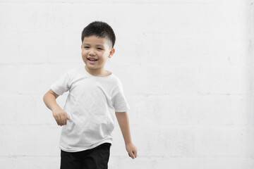 Smart little Asian boy studio portrait on background
