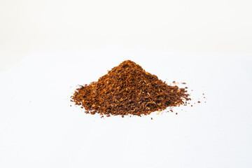 Closed up Heap of Ground Coffee on white background. Extract coffee beans to powder for make any beverage of coffee. Beans of arabica and robusta.