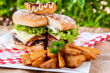 
hamburger fries and fresh vegetables. Gourmet delights