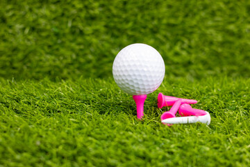 Golf ball is on tee ready to tee off 