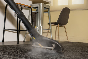 Steam carpet cleaning. Professional Carpet war, water extraction 