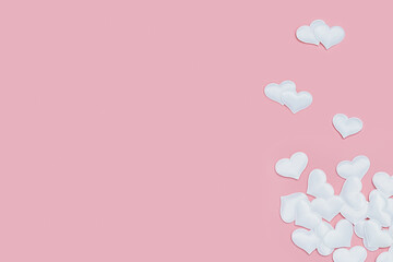 Valentines Day background with white hearts on pink colored. Greeting card or invitation for wedding cards. Pastel colors.