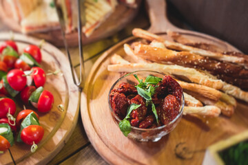 Beautifully decorated catering banquet table with different food snacks and appetizers on corporate christmas birthday party event or wedding celebration