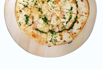 Half pizza with cream cheese, salmon and mozzarella cheese on wooden board isolated on white, top view.