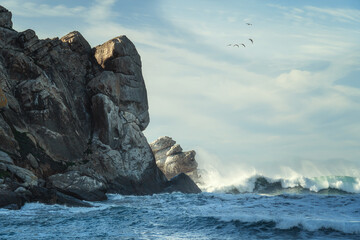 Stormy Pacific ocean and Morro Rock. Morro Bay State Park, California coastline