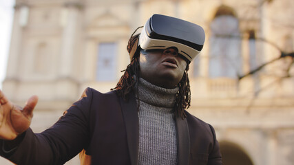 African american black man wearing VR headset outside. High quality photo