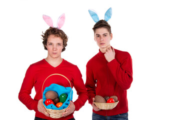 Holidays and weekends. Young attractive couple for Easter in bunny costumes. White background.