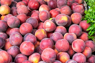 Pile of peaches for sale at a market