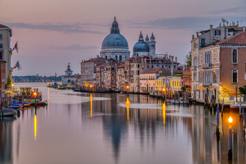 Fototapeta na wymiar The Grand Canal and the Basilica Di Santa Maria Della Salute in Venice early in the morning