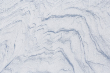 Natural patterns in the snow. Snow background.