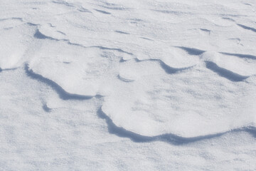 Natural patterns in the snow. Snow background.