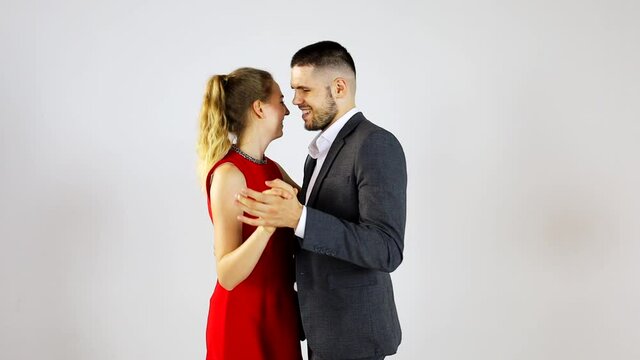 Caucasian couple on prom date is happily dancing together for anniversary and valentine lover concept 