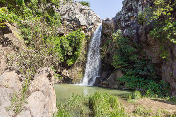 Mountain  Saar Falls with cold and crystal clear water descends from a crevice in the mountains of...